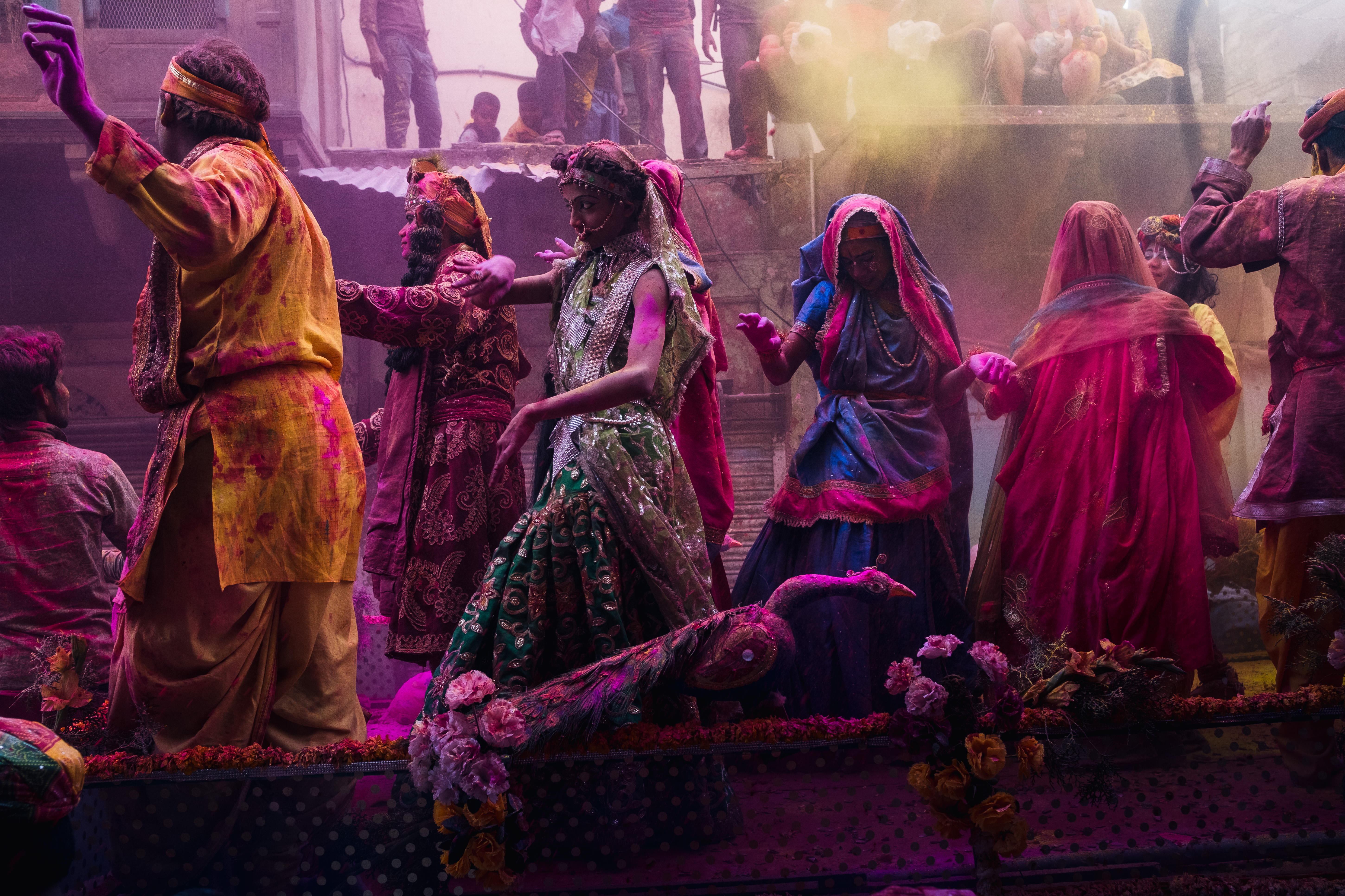 India Street Photography During Holi Festival. dancers on the float as colors are thrown. Images by Jason Vinson