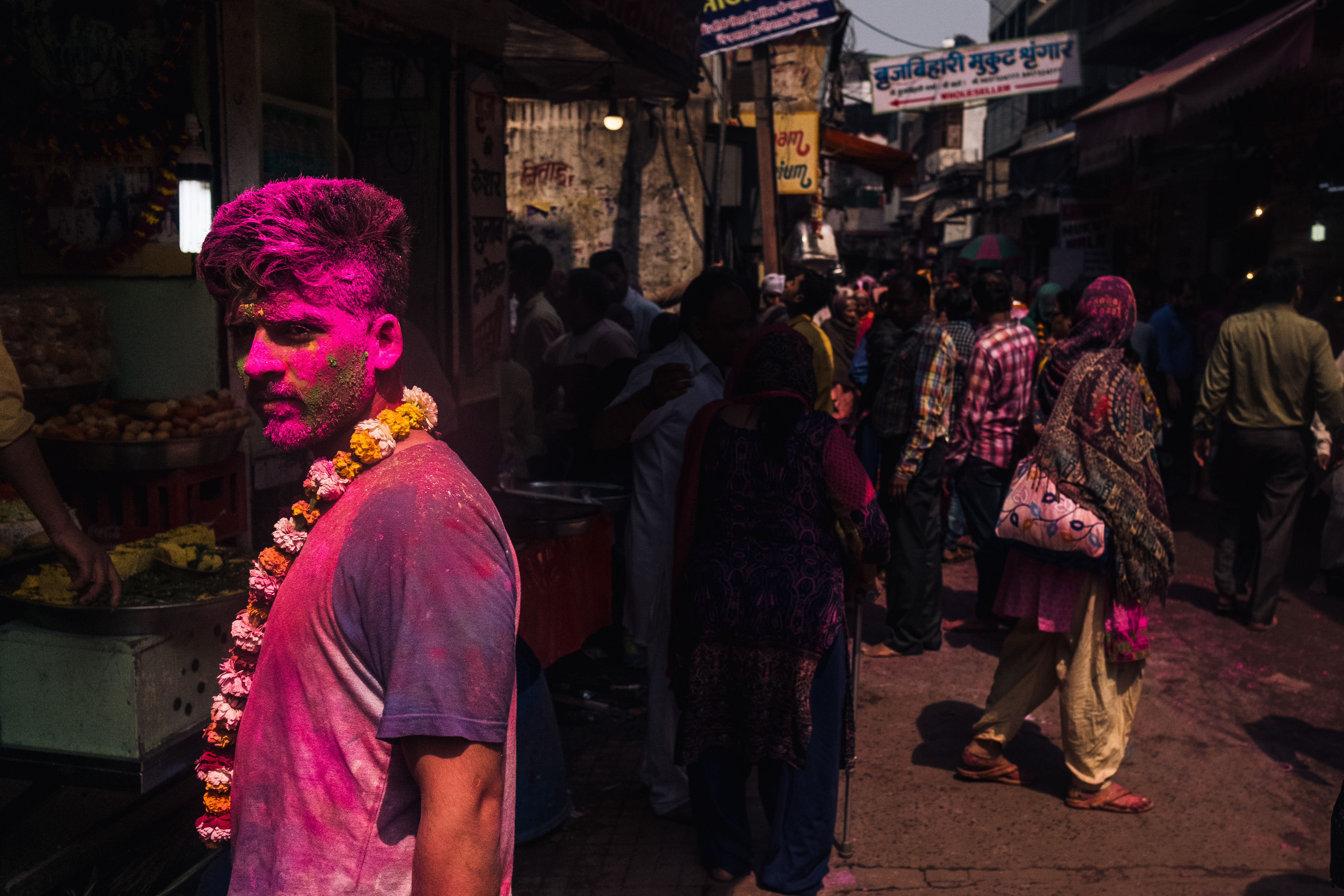 India Street Photography During Holi Festival. Man covered in pink. Images by Jason Vinson