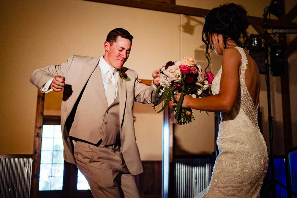Pittsburg-kansas-wedding-photography-vinson-images-entrance-groom-dancing