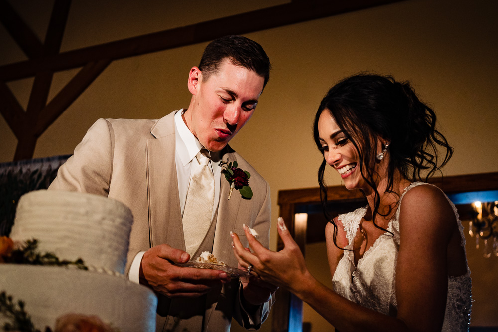 Pittsburg-kansas-wedding-photography-vinson-images-cake-cutting-funny