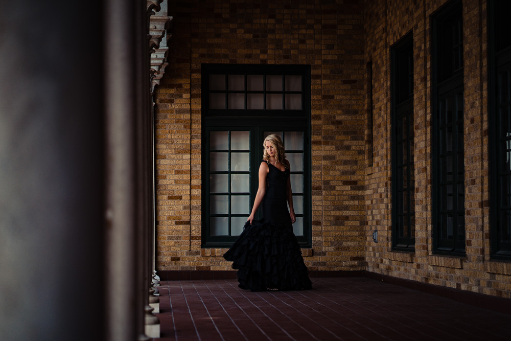 Downtown-rogers-Arkansas-senior-photography-black-prom-dress-twirl