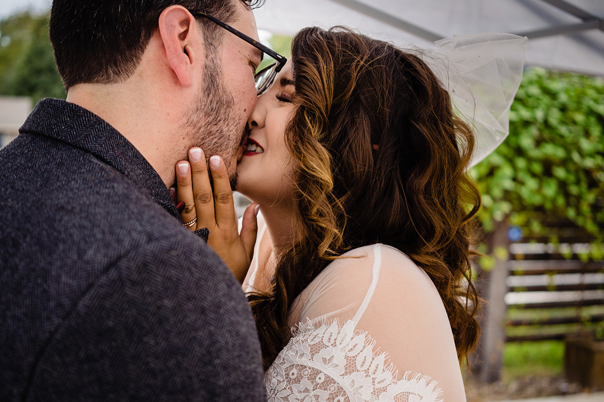 Centerton-Arkansas-Wedding-The-Ravington-NWA-Wedding-bride-and-groom-quite-moment-after-ceremony-kissing