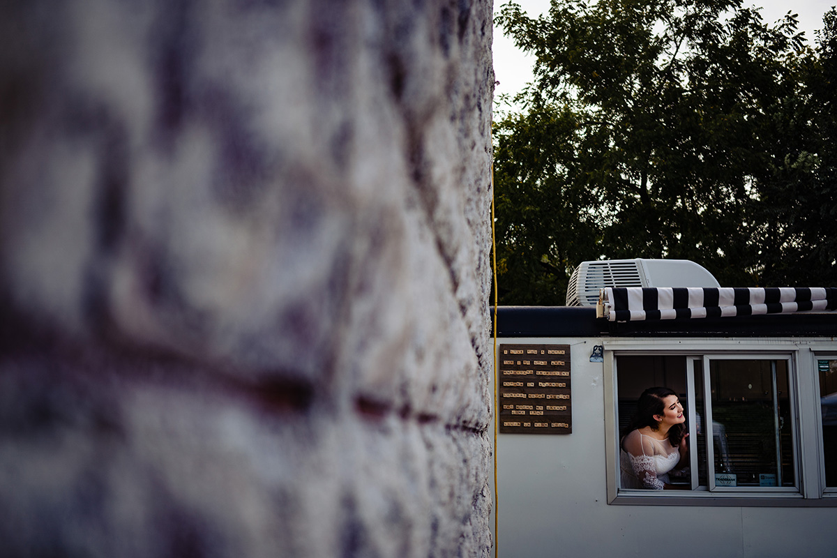 Centerton-Arkansas-Wedding-The-Ravington-NWA-Wedding-bride-looking-out-window-of-coffee-truck