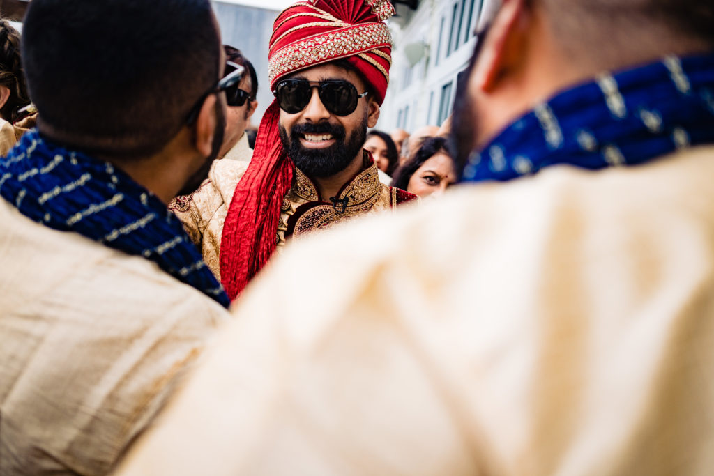 Northwest Arkansas Indian Wedding Photography Vinson Images- ending of the baraat as groom preps for the ceremony 