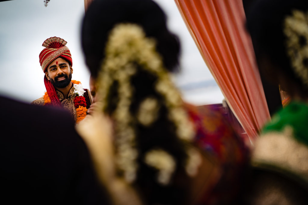 Northwest Arkansas Indian Wedding Photography Vinson Images- the grooms face as he sees his bride for the first time 