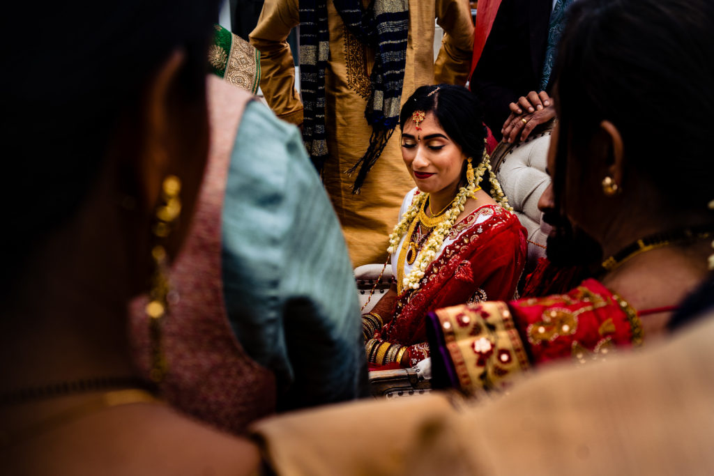 Northwest Arkansas Indian Wedding Photography Vinson Images- bride with smile on her face as she enjoys the ceremony 