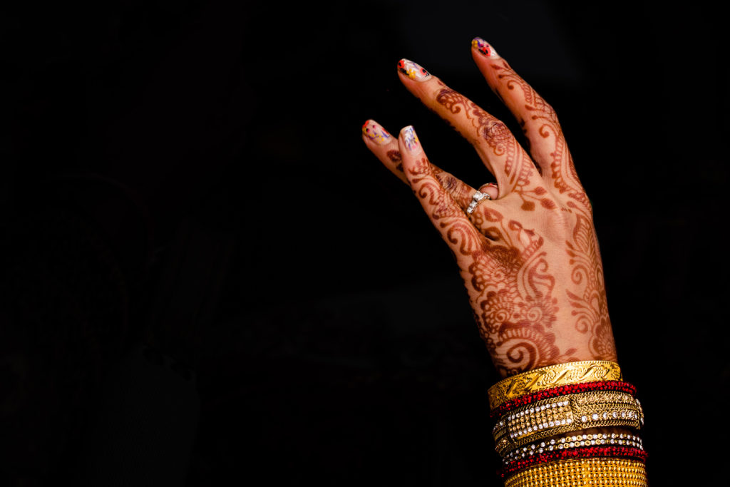 Northwest Arkansas Indian Wedding Photography Vinson Images- closeup on brides hand as she plays with her wedding ring 