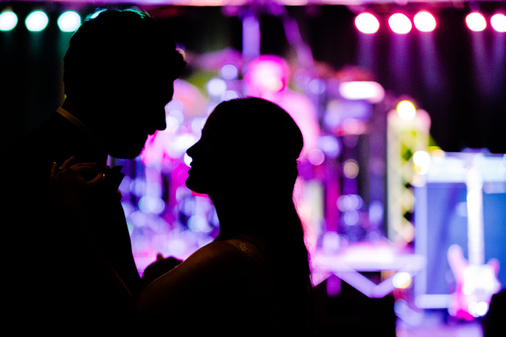 Vinson Images - Walton Arts Center Wedding - bride and groom dance in Star theater