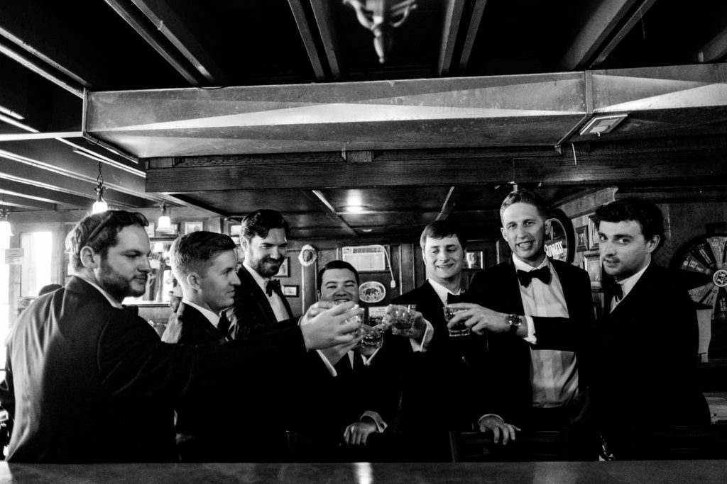 Northwest Arkansas Wedding Photography - Dickson Street pub - Groomsmen toast to wedding
