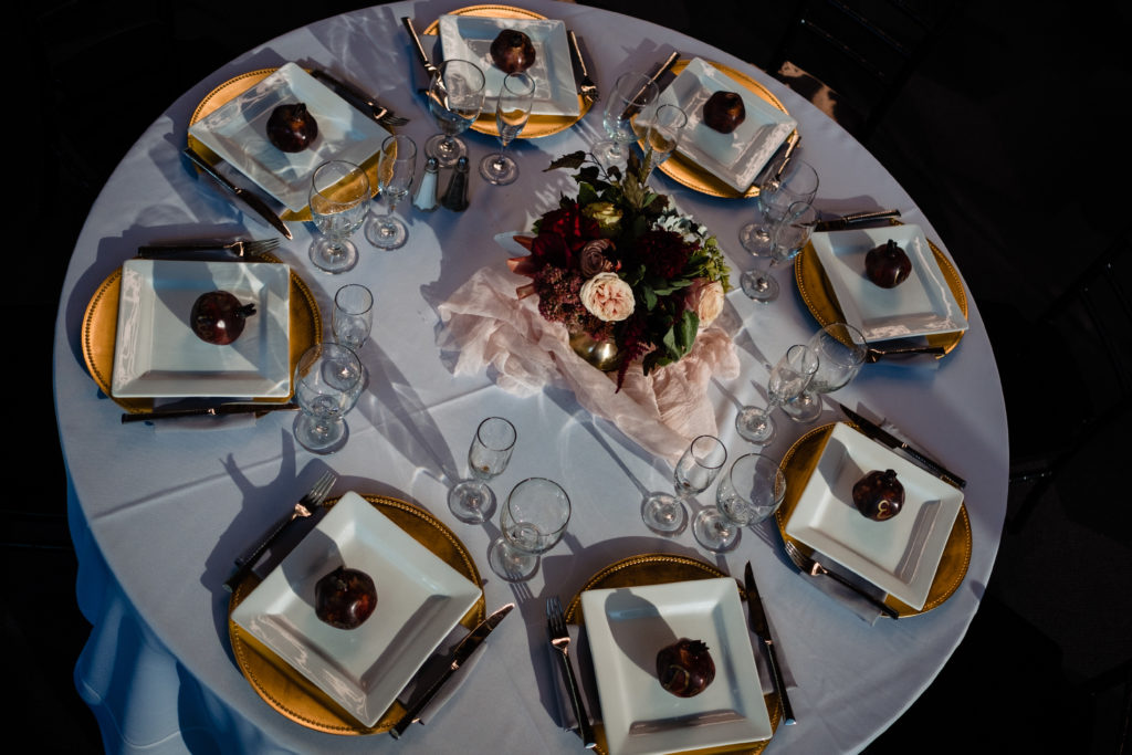Vinson Images - Walton Arts Center Wedding - gold plates and pomegranate