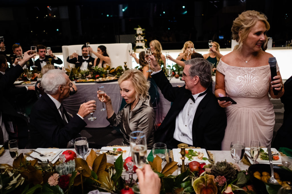 Vinson Images - Walton Arts Center Wedding - gusts laugh and toast to the bride and groom