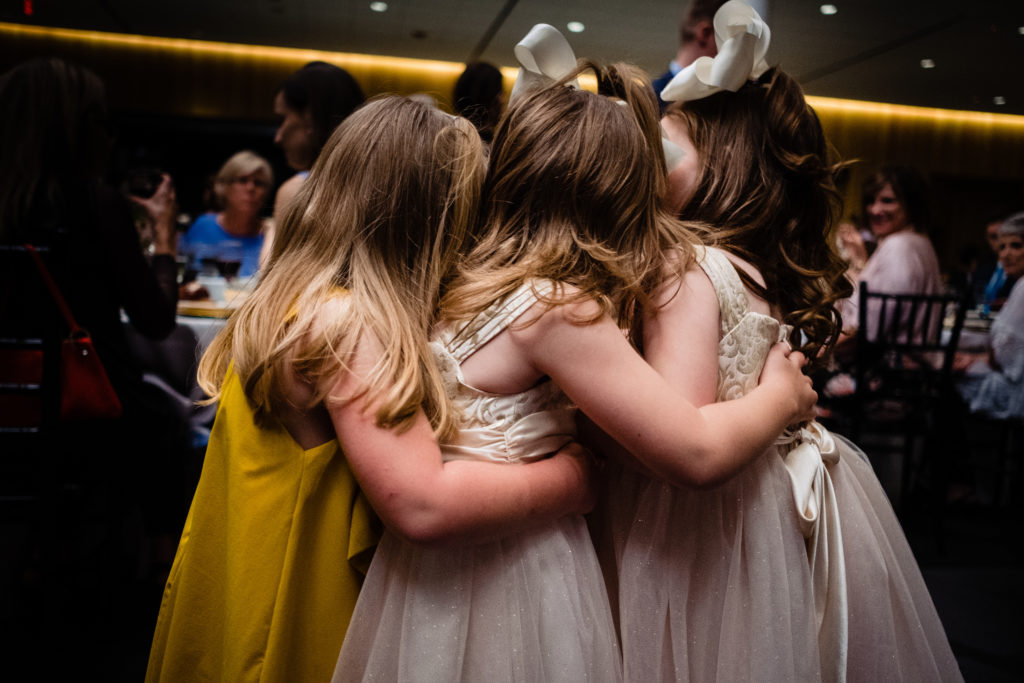 Vinson Images - Walton Arts Center Wedding - flower girls hugging each other
