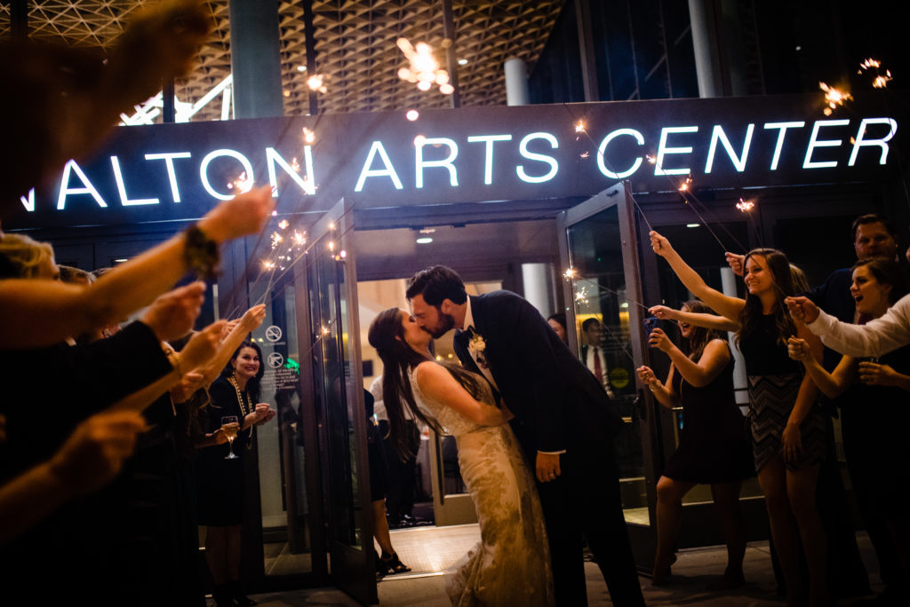 Vinson Images - Walton Arts Center Wedding - bride and groom kiss at sparkler exit