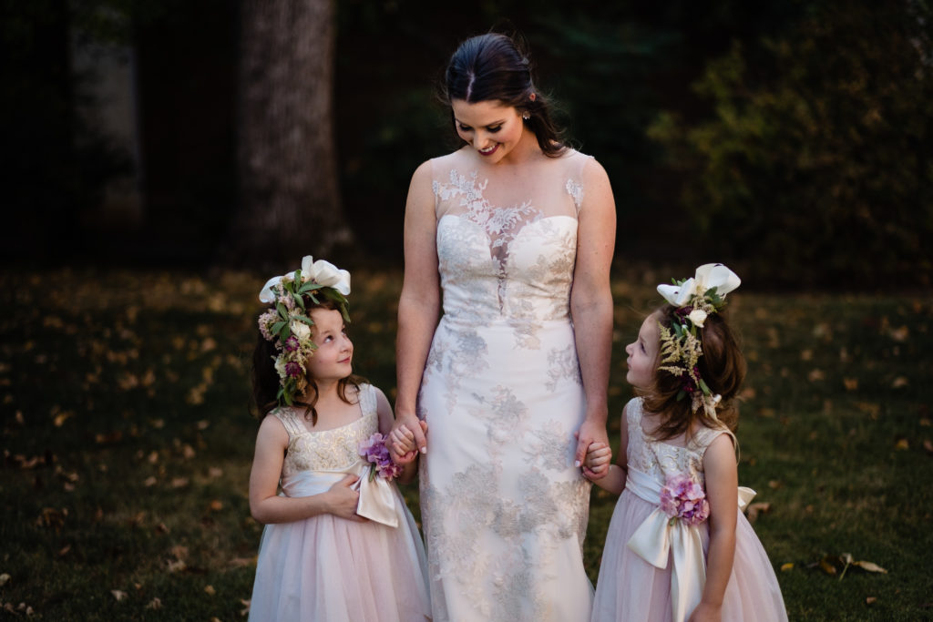 Northwest Arkansas Wedding photographer - Inn at Carnall Hall - bride and flower girls laugh