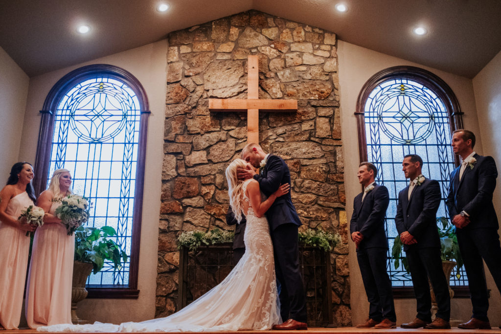 The Stone Chapel At Matt Lane Farms - Fayetteville Arkansas wedding - bride and groom first kiss