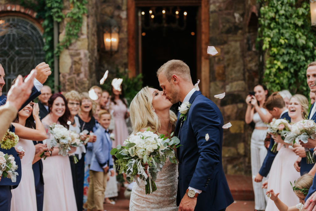 The Stone Chapel At Matt Lane Farms - Fayetteville Arkansas wedding - bride and groom kiss as they leave the ceremony 