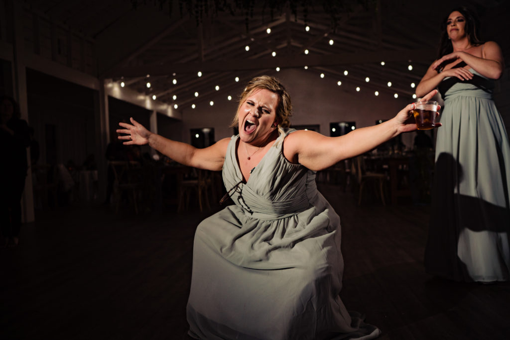 Kindred North Wedding - Northwest Arkansas Wedding - Vinson Images - bridesmaid celebrating on dance floor