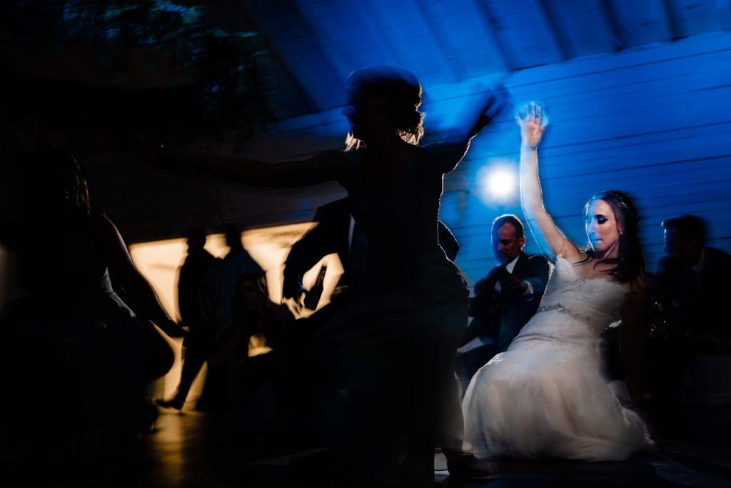 Kindred North Wedding - Northwest Arkansas Wedding - Vinson Images - bride doing a limbo bend