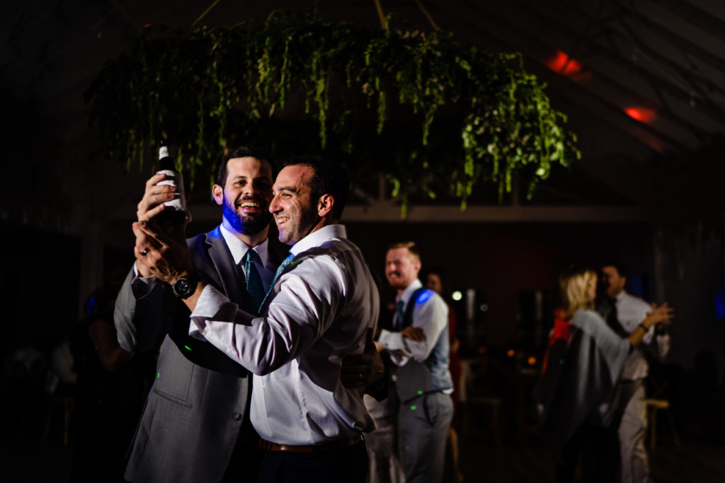 Kindred North Wedding - Northwest Arkansas Wedding - Vinson Images - guys celebrating on dance floor