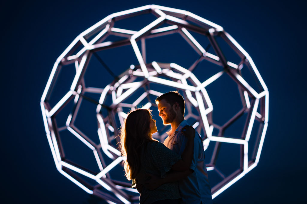 best wedding venues in Northwest Arkansas couples laughs under night sky at Crystal Bridges Museum of art