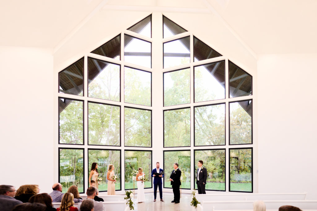 Cave Springs wedding ceremony at Osage House glass chapel 