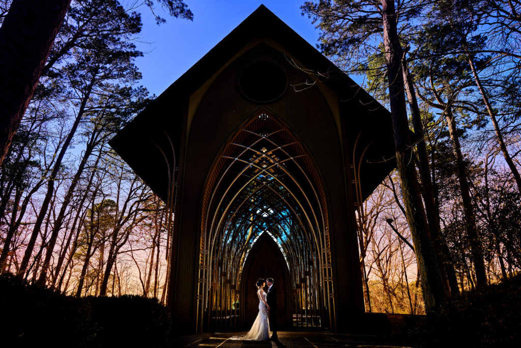 Portrait of bride and groom at sunset in front of the Mildred B. Cooper Chapel 