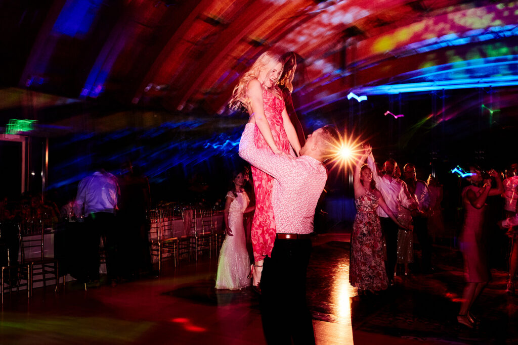 guests party dancing during a Crystal Bridges Wedding Reception 